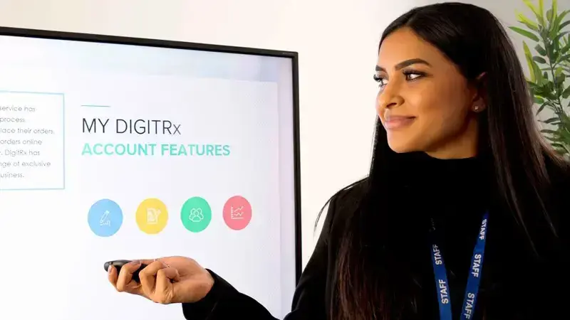 Healthcare Professional providing a training presentation on a large screen